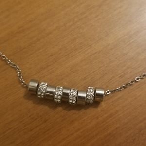 Silver toned necklace with rhinestones.